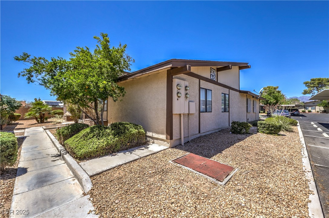 5829 Smoke Ranch Road, Unit C Las Vegas, NV 89108 - Photo 23 of 25 View of property exterior with stucco siding