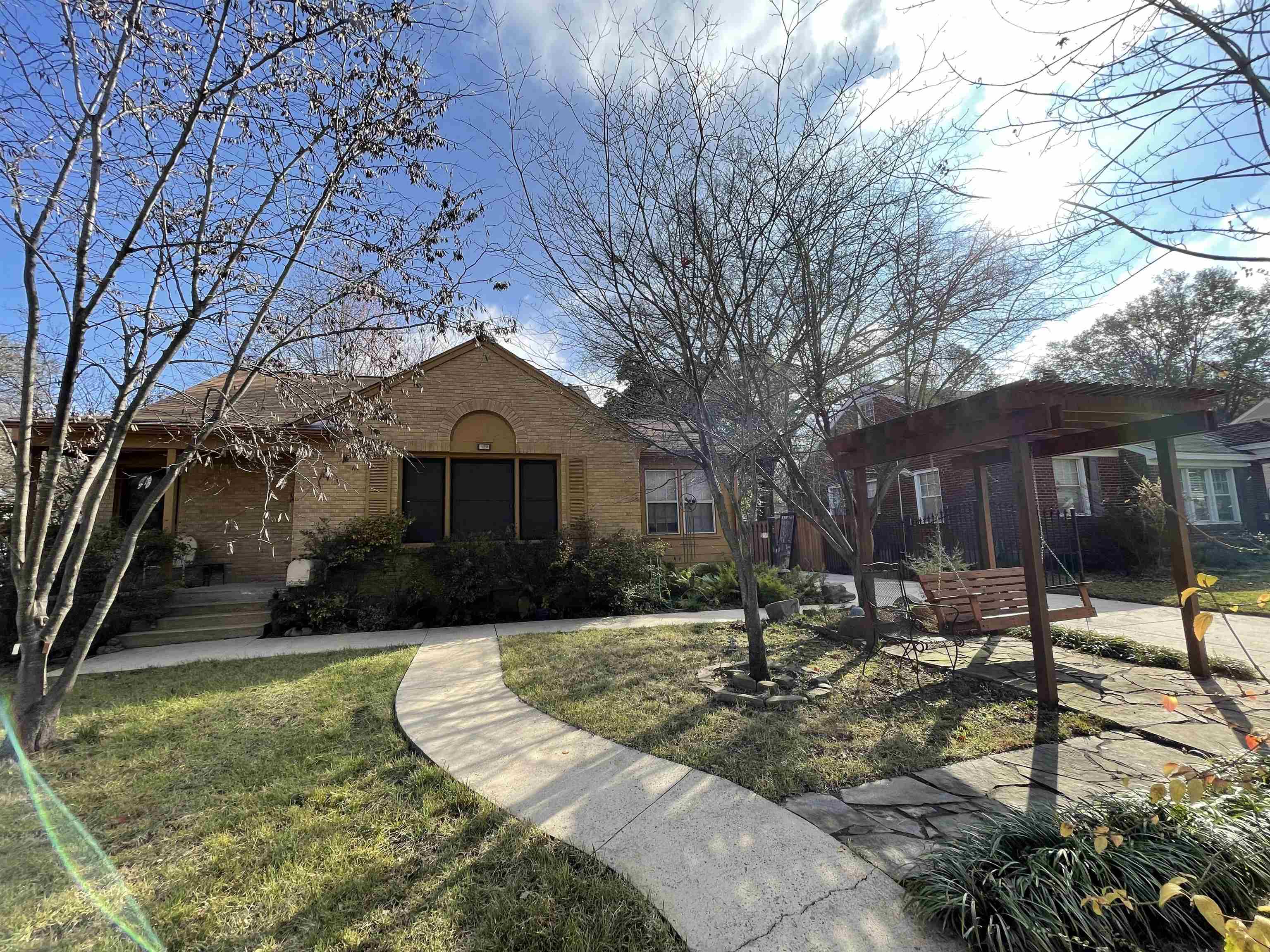 1020 Sandra Street Memphis, TN 38122 - Photo 1 of 40 a front view of a house with garden