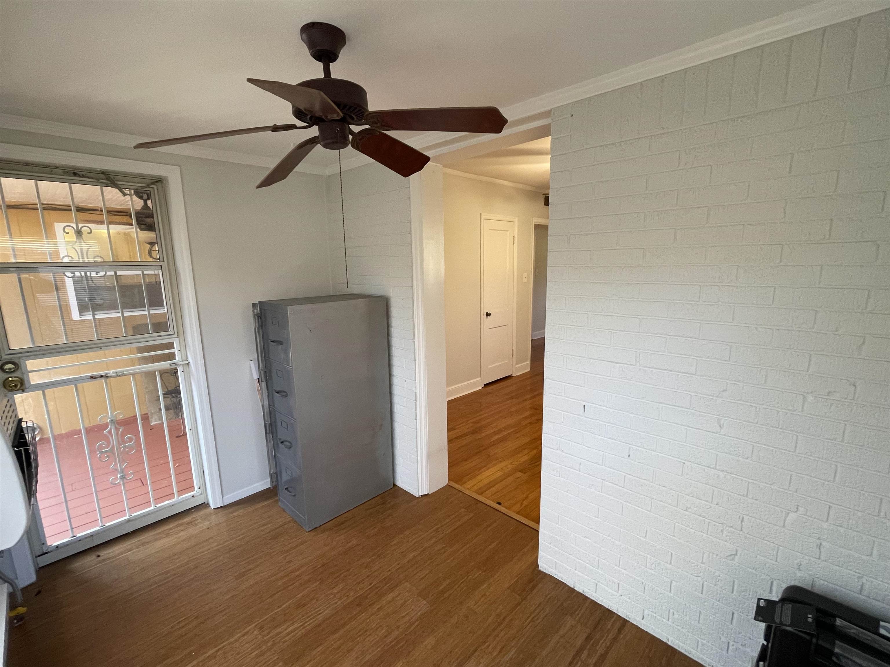 1020 Sandra Street Memphis, TN 38122 - Photo 17 of 40 a view of empty room with wooden floor and fan