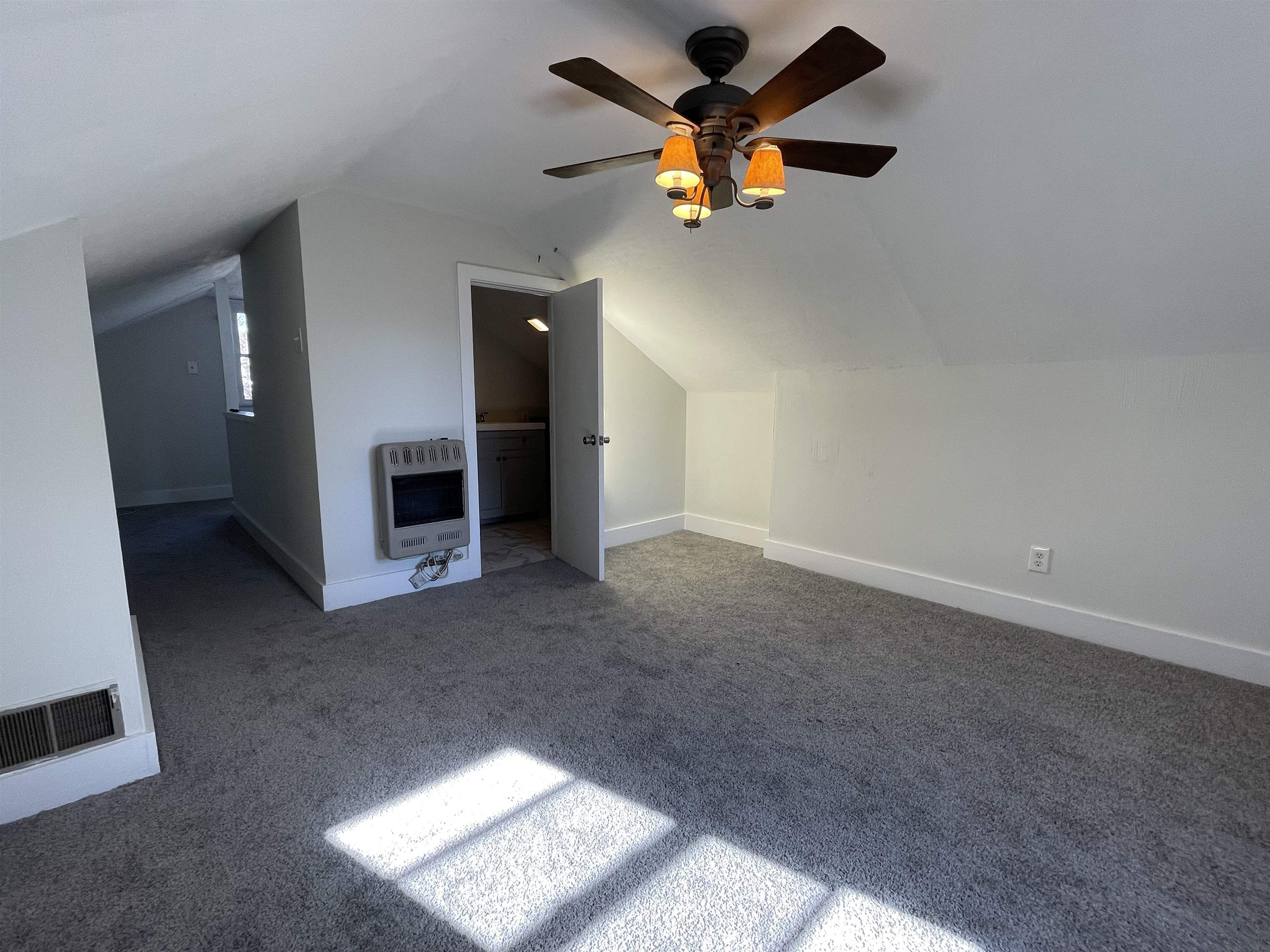1020 Sandra Street Memphis, TN 38122 - Photo 24 of 40 an empty room with a window and a ceiling fan