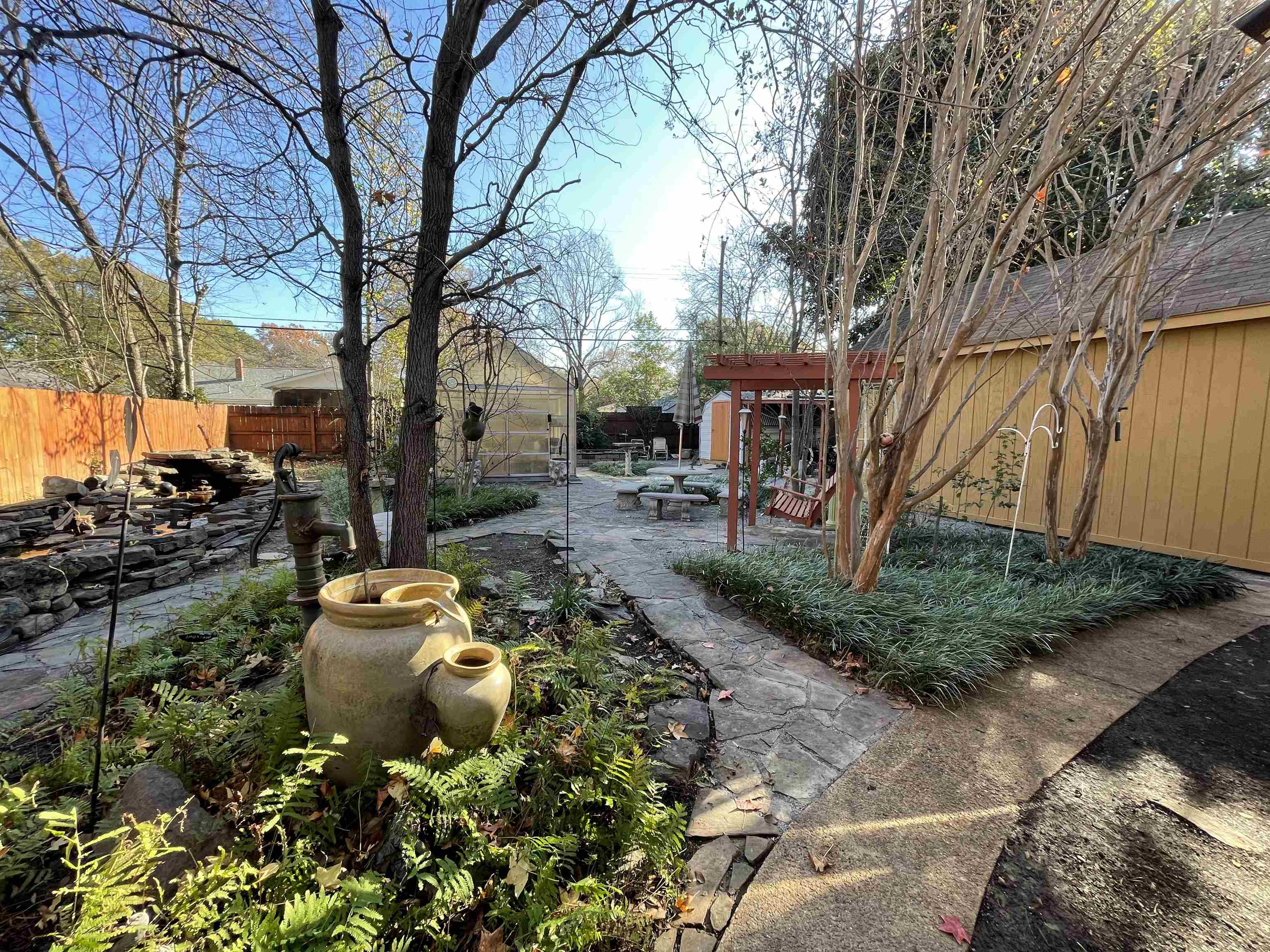 1020 Sandra Street Memphis, TN 38122 - Photo 34 of 40 a wooden bench sitting in front of a house