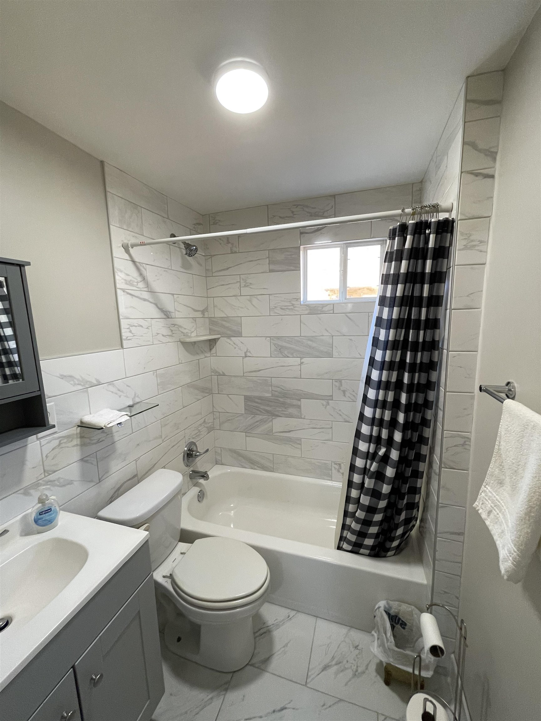 1020 Sandra Street Memphis, TN 38122 - Photo 40 of 40 a bathroom with a granite countertop bathtub sink vanity mirror and toilet