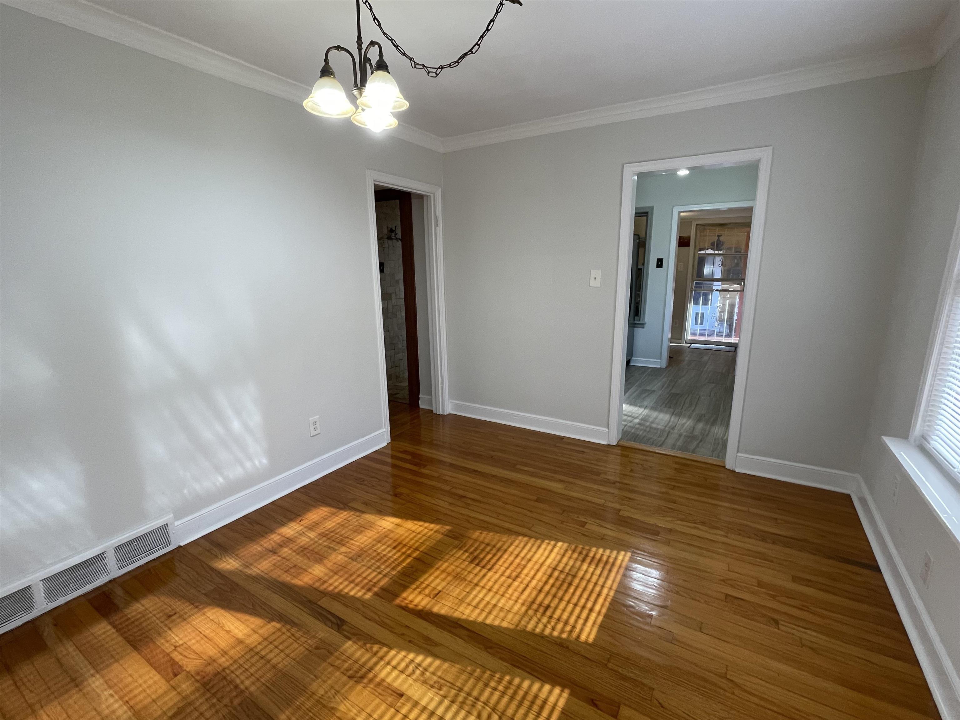 1020 Sandra Street Memphis, TN 38122 - Photo 8 of 40 a view of room with wooden floor and ceiling fan