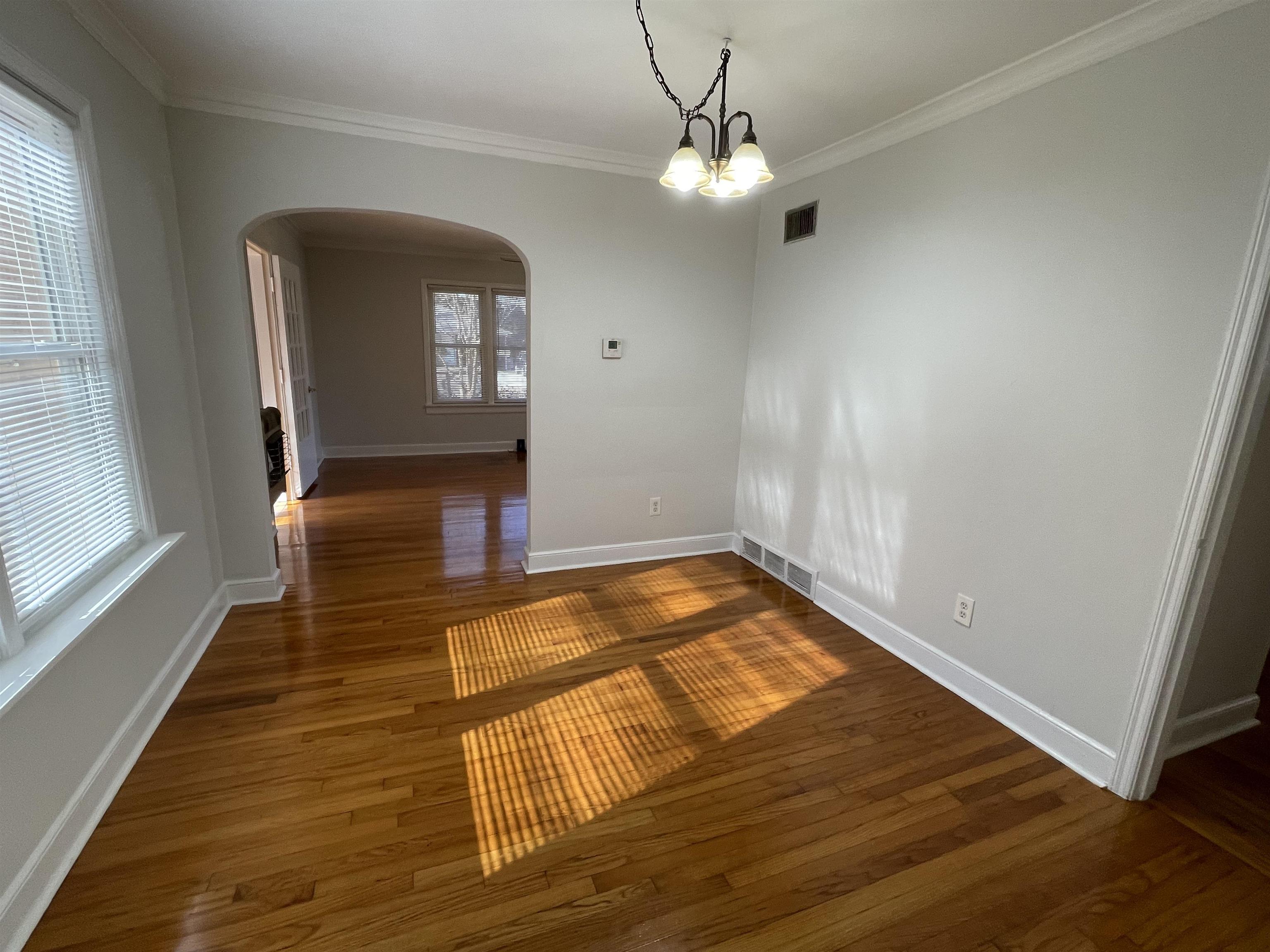 1020 Sandra Street Memphis, TN 38122 - Photo 9 of 40 a view of a livingroom with wooden floor and staircase