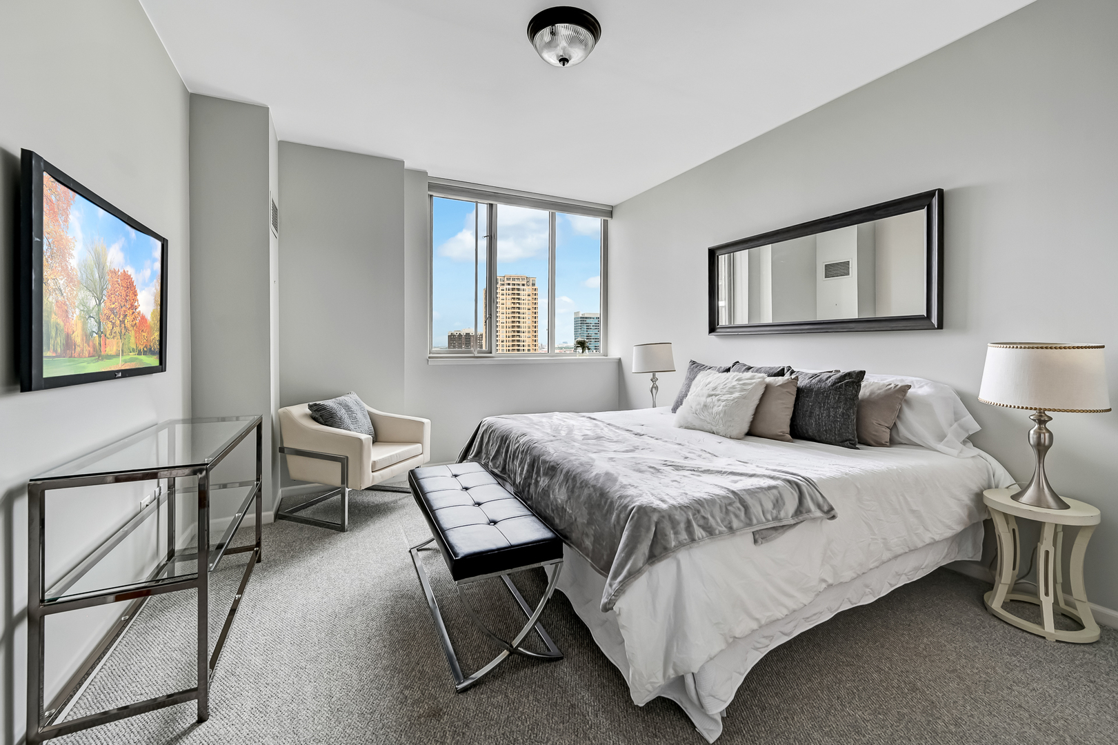 1515 South Prairie Avenue, Unit 1318 Chicago, IL 60605 - Photo 16 of 31 a bedroom with a bed and wooden floor