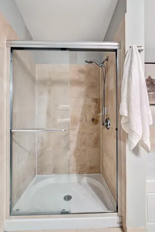 a bathroom with a shower and a sink