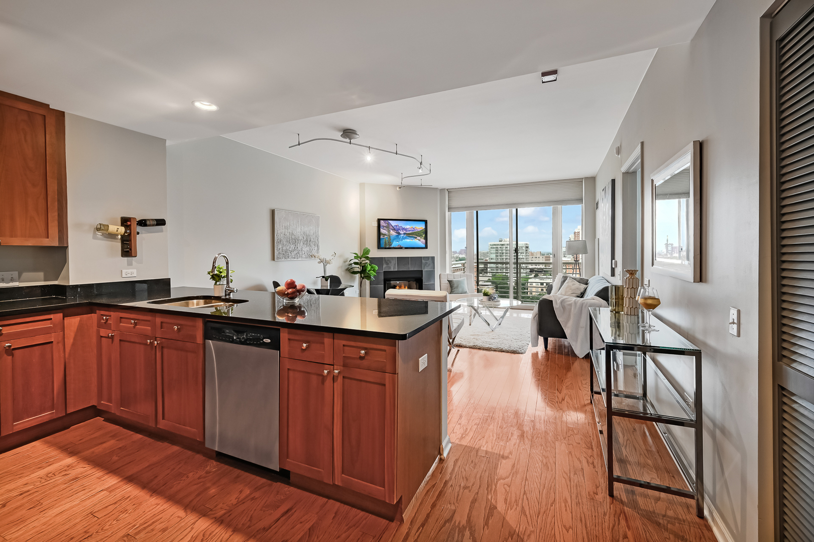 1515 South Prairie Avenue, Unit 1318 Chicago, IL 60605 - Photo 5 of 31 a kitchen with granite countertop a table chairs stove and wooden floor