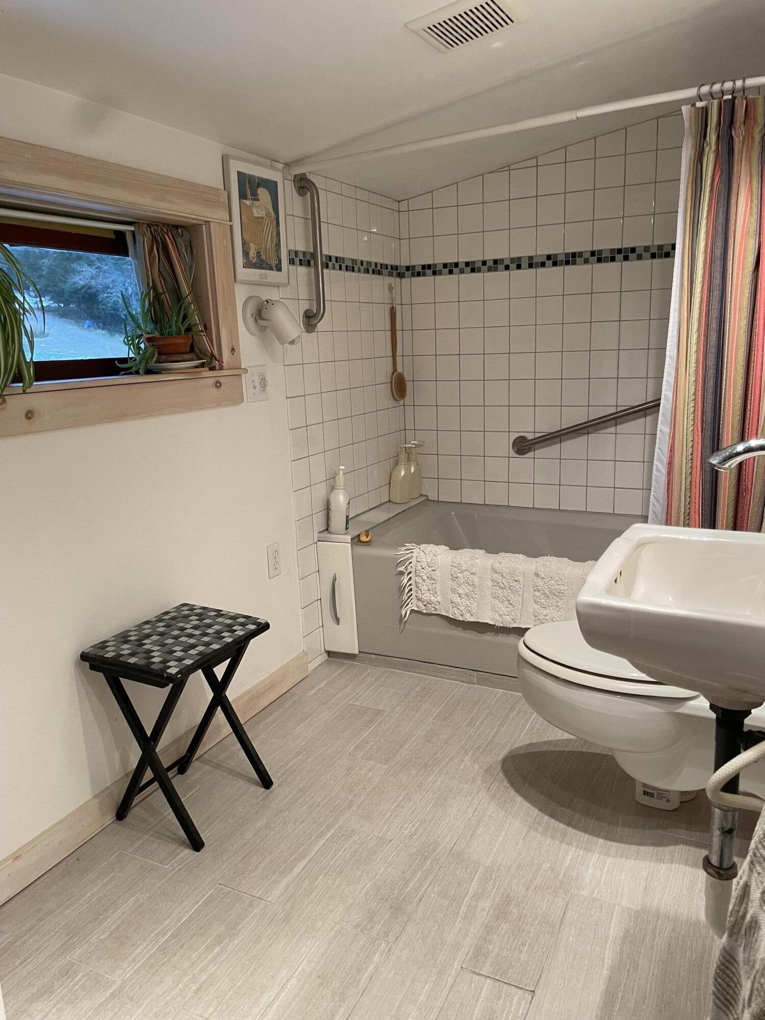 349 Oceanville Road Stonington, ME 04681 - Photo 15 of 16 Tiled tub and shower.