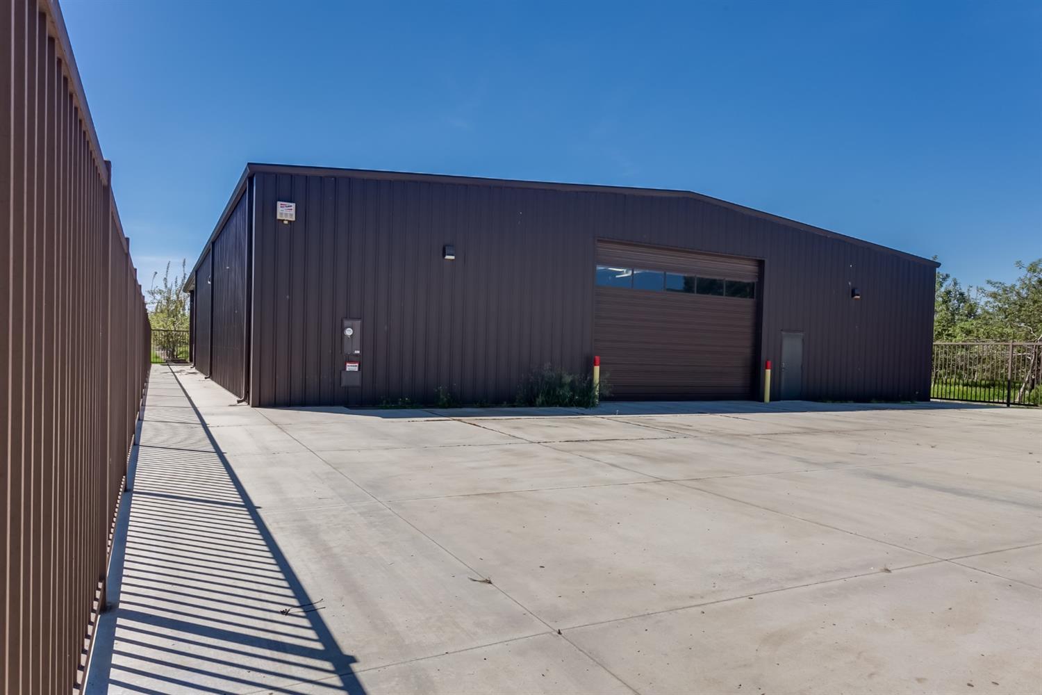 14954 Tim Bell Road Waterford, CA 95386 - Photo 5 of 28 a house view with a backyard