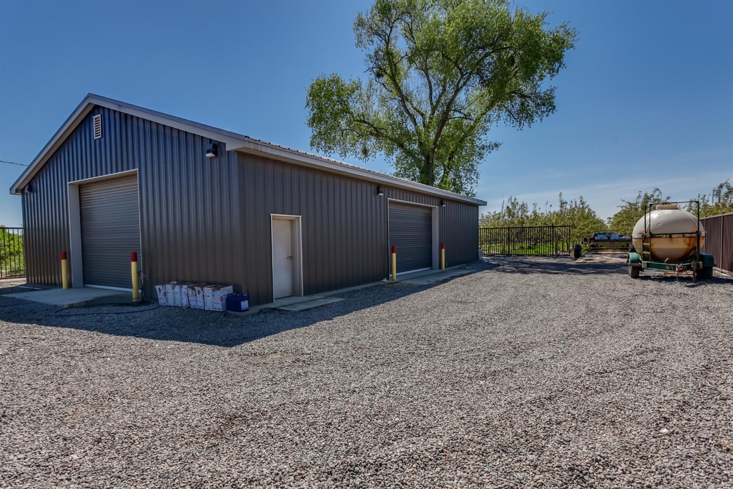 14954 Tim Bell Road Waterford, CA 95386 - Photo 6 of 28 a front view of a house with a yard
