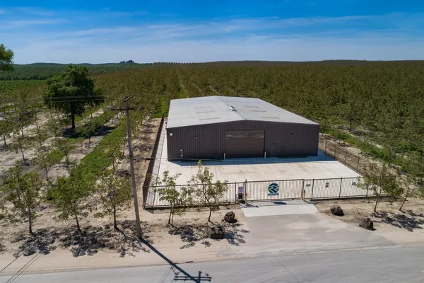 a picture of a lake with a building in the background