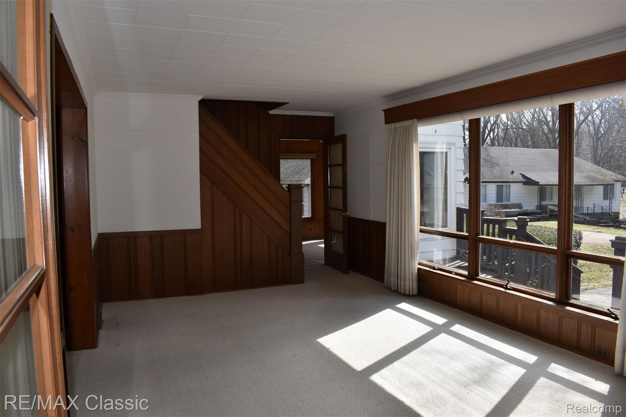 3980 Benstein Road Commerce Township, MI 48382 - Photo 28 of 68 Living room with stairway to upper level. 18x11