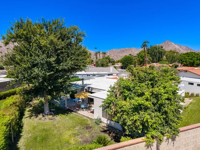 a view of a balcony with two chairs and a table