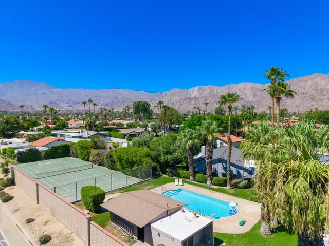 an aerial view of a city and mountain