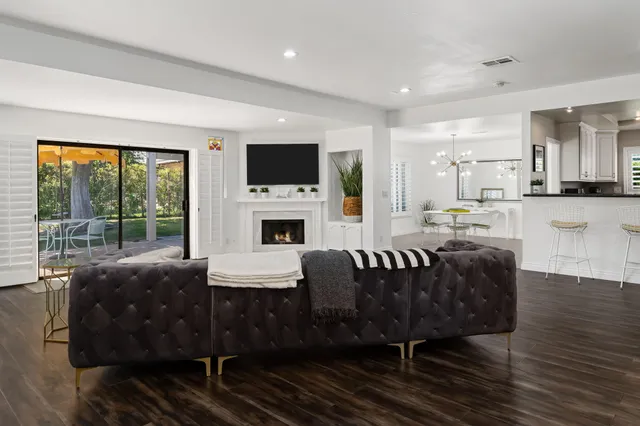 a view of kitchen center island dining table and wooden floor