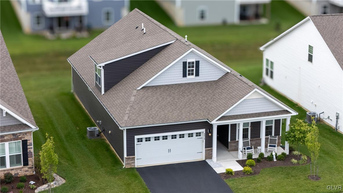 8078 Schaefer Crest Breinigsville, PA 18031 - Photo 2 of 35 a aerial view of a house with a yard potted plants and a table