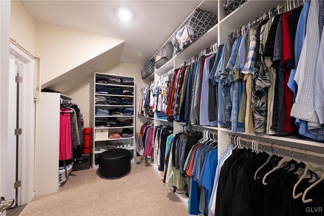 8078 Schaefer Crest Breinigsville, PA 18031 - Photo 24 of 35 a view of walk in closet with clothes and shoes