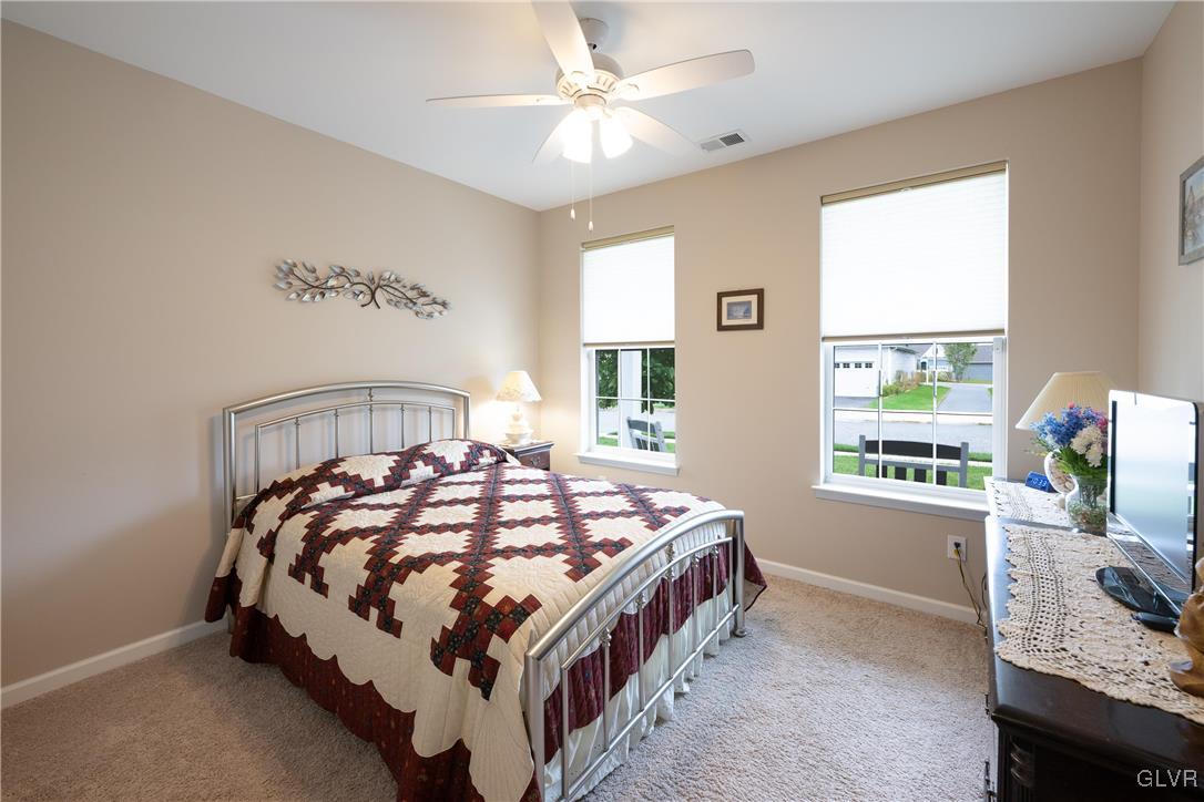 8078 Schaefer Crest Breinigsville, PA 18031 - Photo 27 of 35 a bedroom with a bed next to a window with the dresser