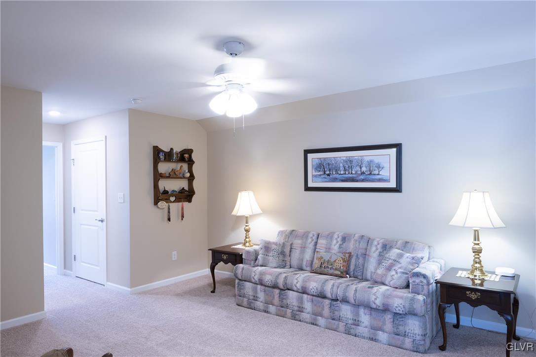 8078 Schaefer Crest Breinigsville, PA 18031 - Photo 29 of 35 a living room with furniture and a lamp