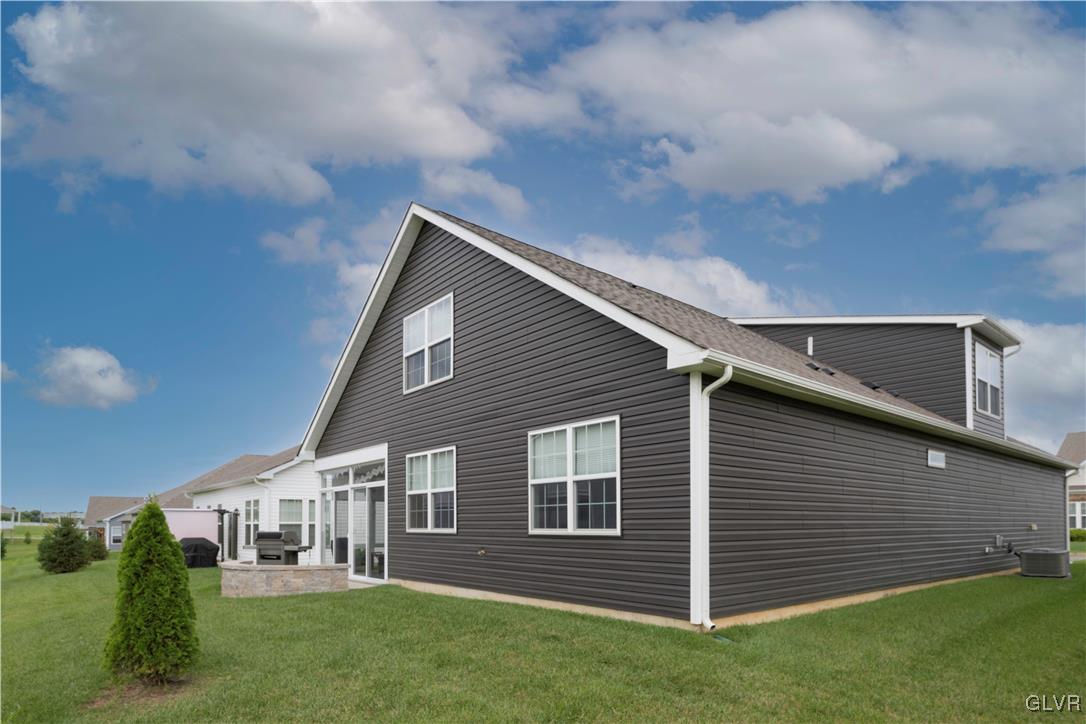 8078 Schaefer Crest Breinigsville, PA 18031 - Photo 34 of 35 a view of a house with a backyard