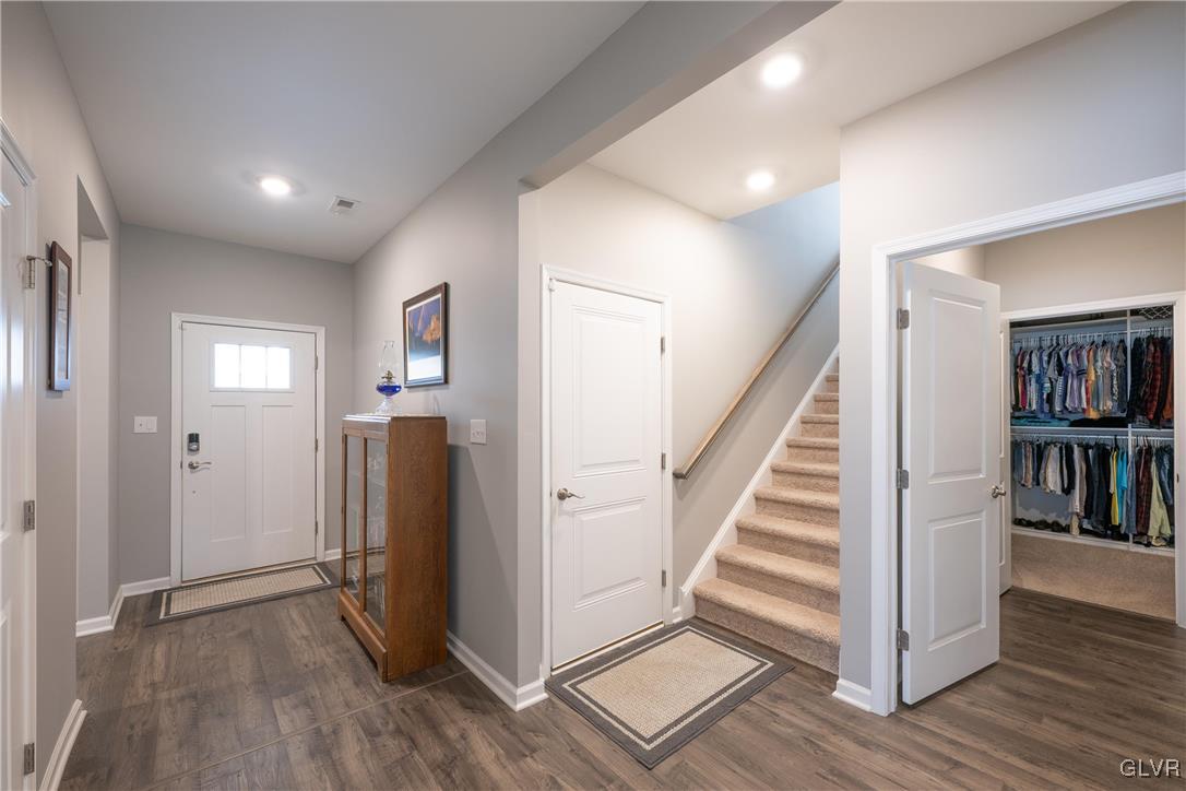 8078 Schaefer Crest Breinigsville, PA 18031 - Photo 5 of 35 a view of entryway with wooden floor and stairs