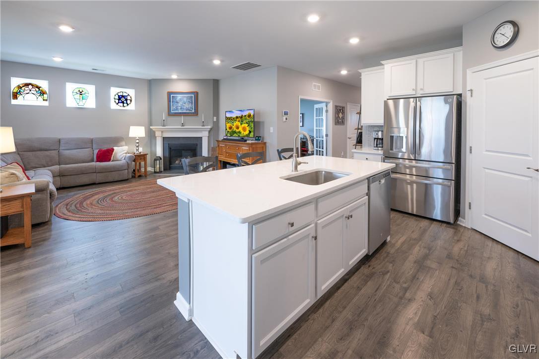 8078 Schaefer Crest Breinigsville, PA 18031 - Photo 7 of 35 a kitchen with white cabinets and stainless steel appliances