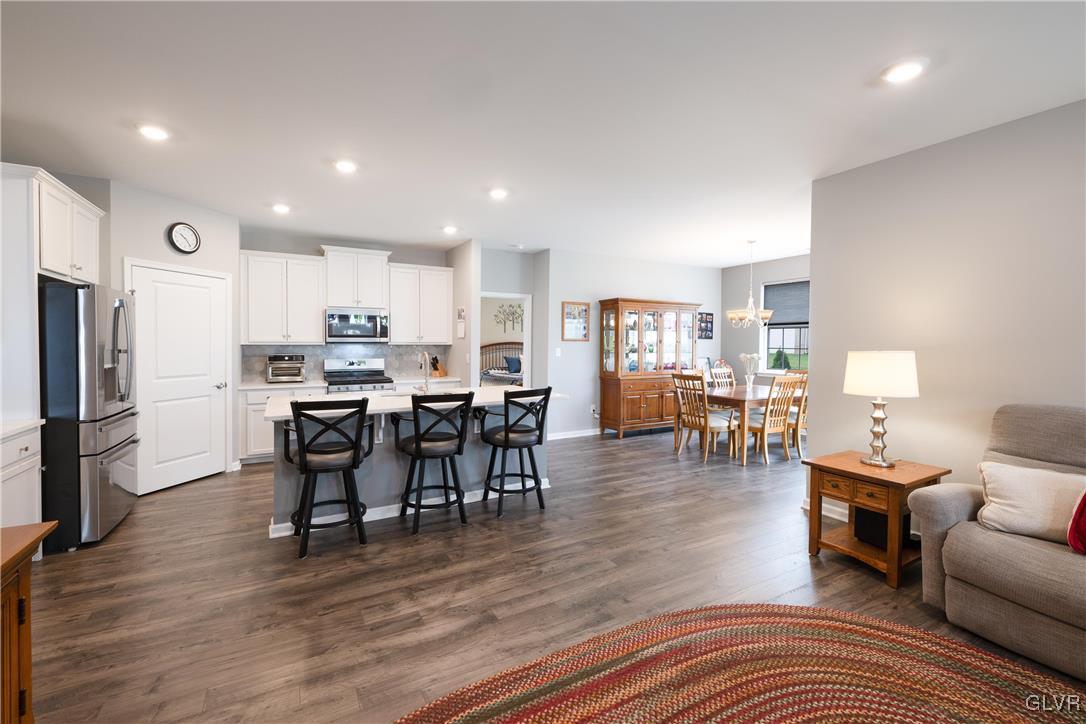 8078 Schaefer Crest Breinigsville, PA 18031 - Photo 10 of 35 a living room with stainless steel appliances furniture wooden floor and a kitchen view