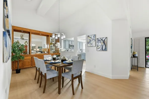 a view of a dining room with furniture window and outside view