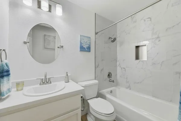 a bathroom with a bathtub and a toilet