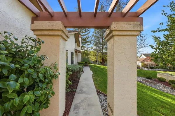 a view of a pathway with a yard