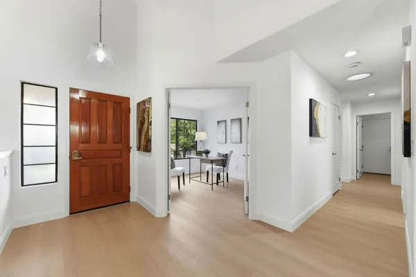 a view of a livingroom with furniture and an entryway