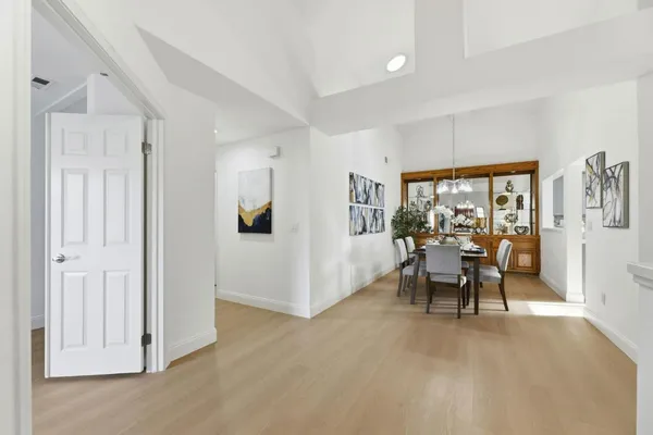 a view of a livingroom with furniture and a window