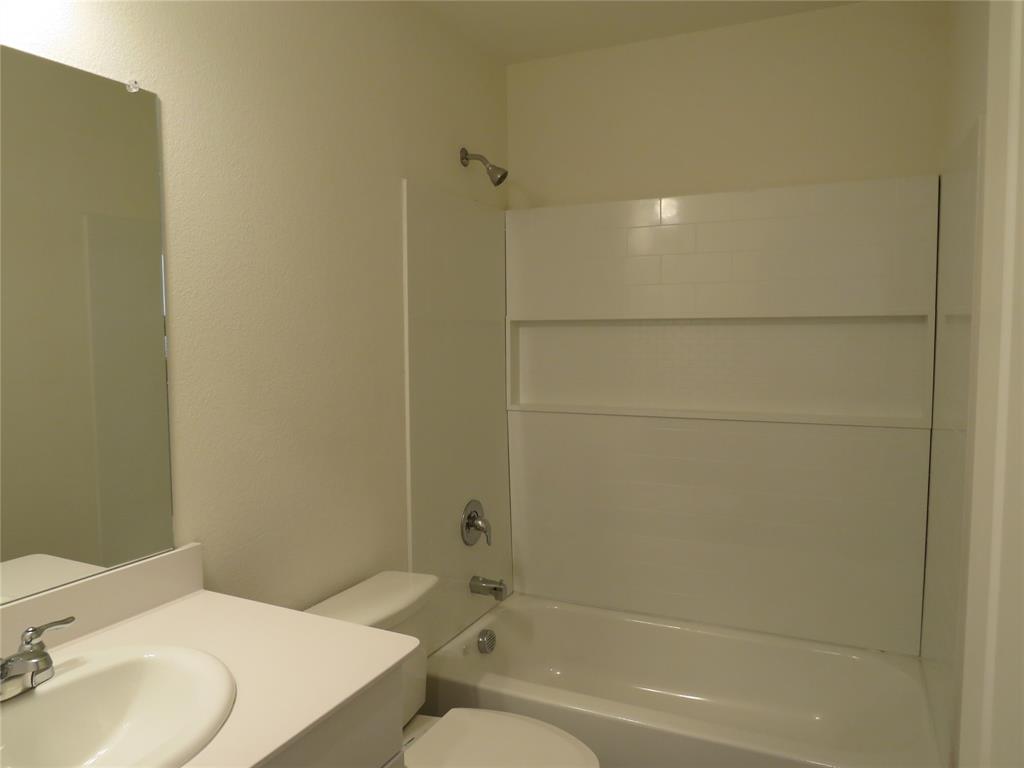 1906 Chapel Hill Road Princeton, TX 75407 - Photo 15 of 36 a bathroom with a sink toilet and shower