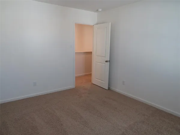 a bathroom with a window and a shower