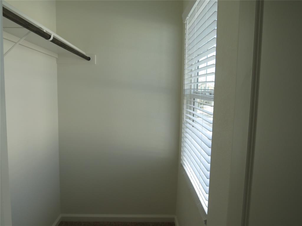 1906 Chapel Hill Road Princeton, TX 75407 - Photo 17 of 36 a bathroom with a window and a shower