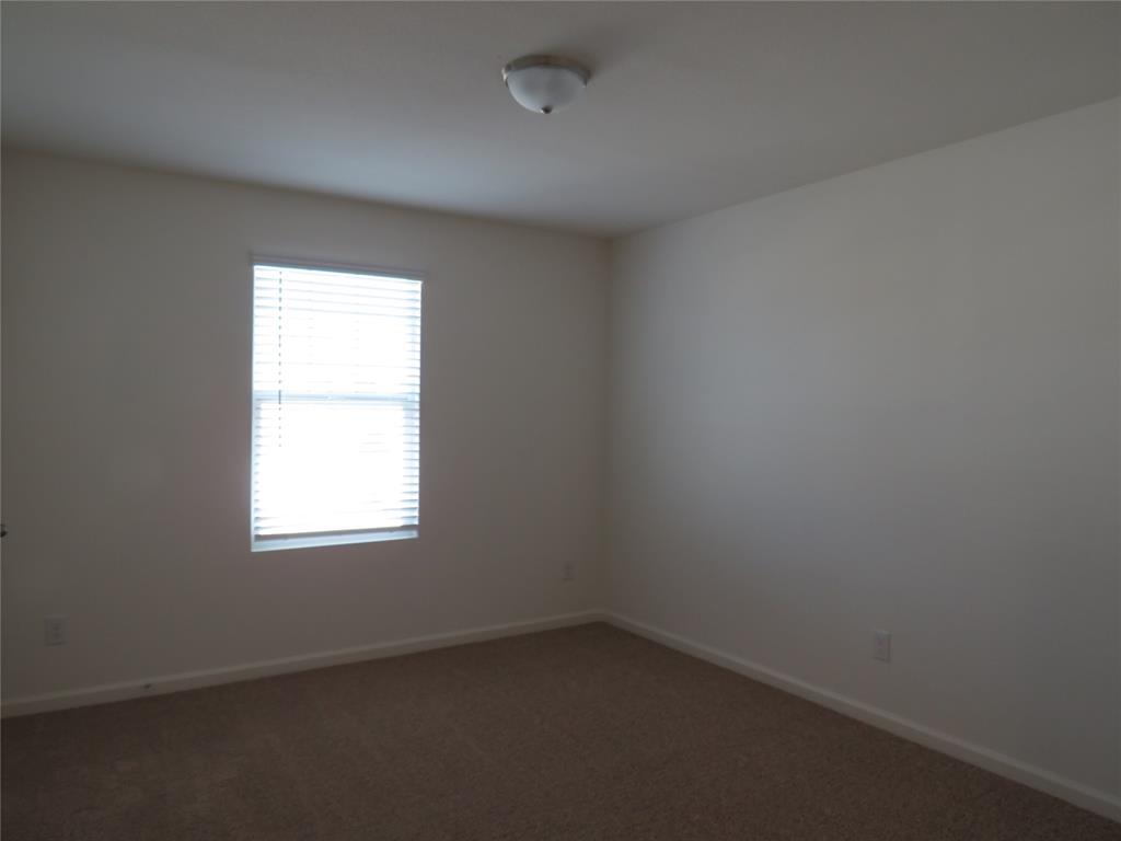 1906 Chapel Hill Road Princeton, TX 75407 - Photo 18 of 36 an empty room with a window
