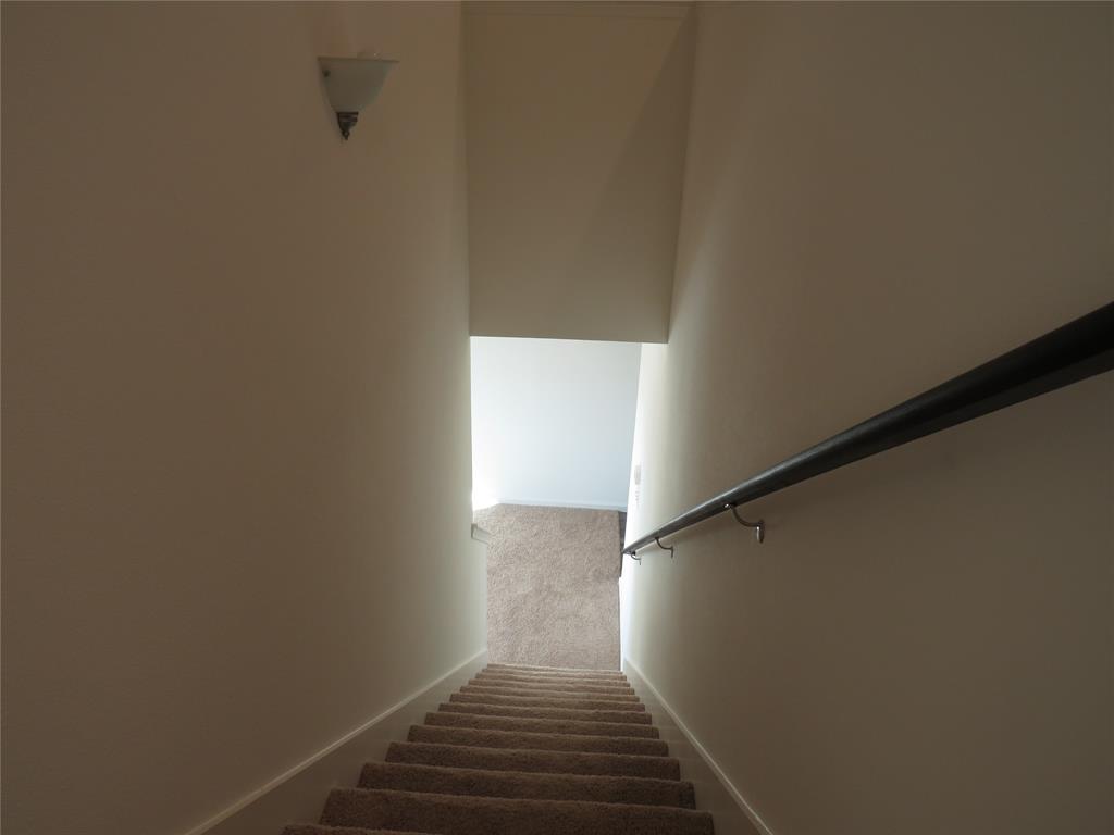 1906 Chapel Hill Road Princeton, TX 75407 - Photo 21 of 36 a view of a hallway with wooden floor and staircase