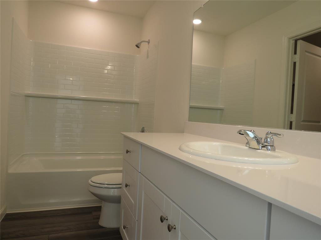 1906 Chapel Hill Road Princeton, TX 75407 - Photo 29 of 36 a bathroom with a sink a toilet and shower