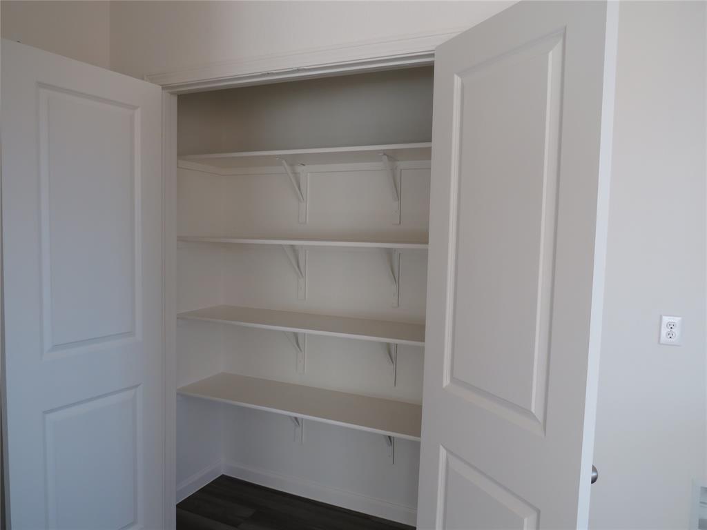 1906 Chapel Hill Road Princeton, TX 75407 - Photo 35 of 36 a view of walk in closet with empty racks