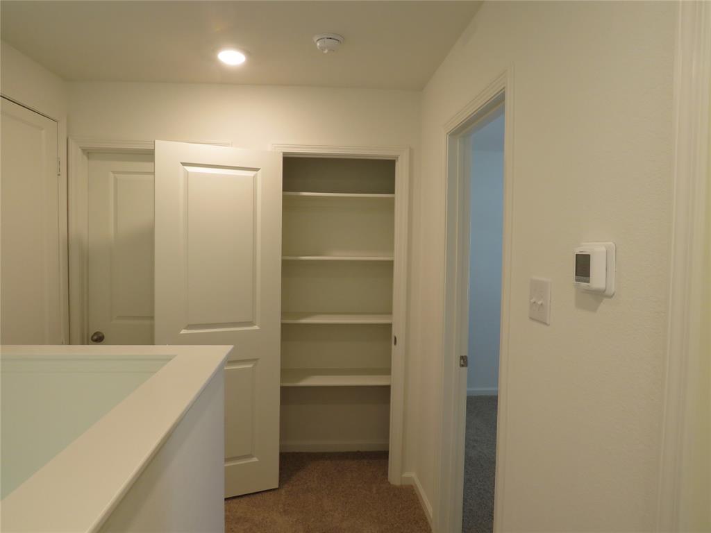 1906 Chapel Hill Road Princeton, TX 75407 - Photo 10 of 36 a room with storage and utility