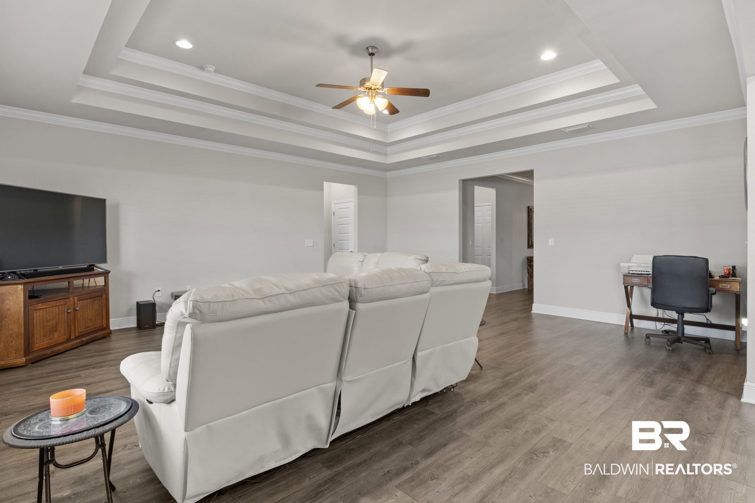 2050 Bourbon Street Foley, AL 36535 - Photo 11 of 32 Living room with a raised ceiling, hardwood / wood-style floors, and ornamental molding