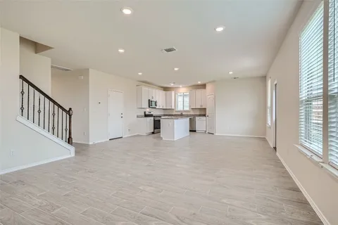 a view of a kitchen with a sink and cabinets
