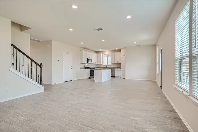 a view of a kitchen with a sink and cabinets