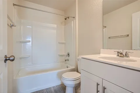 a bathroom with a sink a toilet and a bathtub
