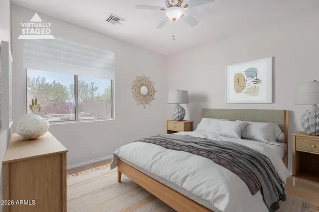 a bedroom with a large bed and a window