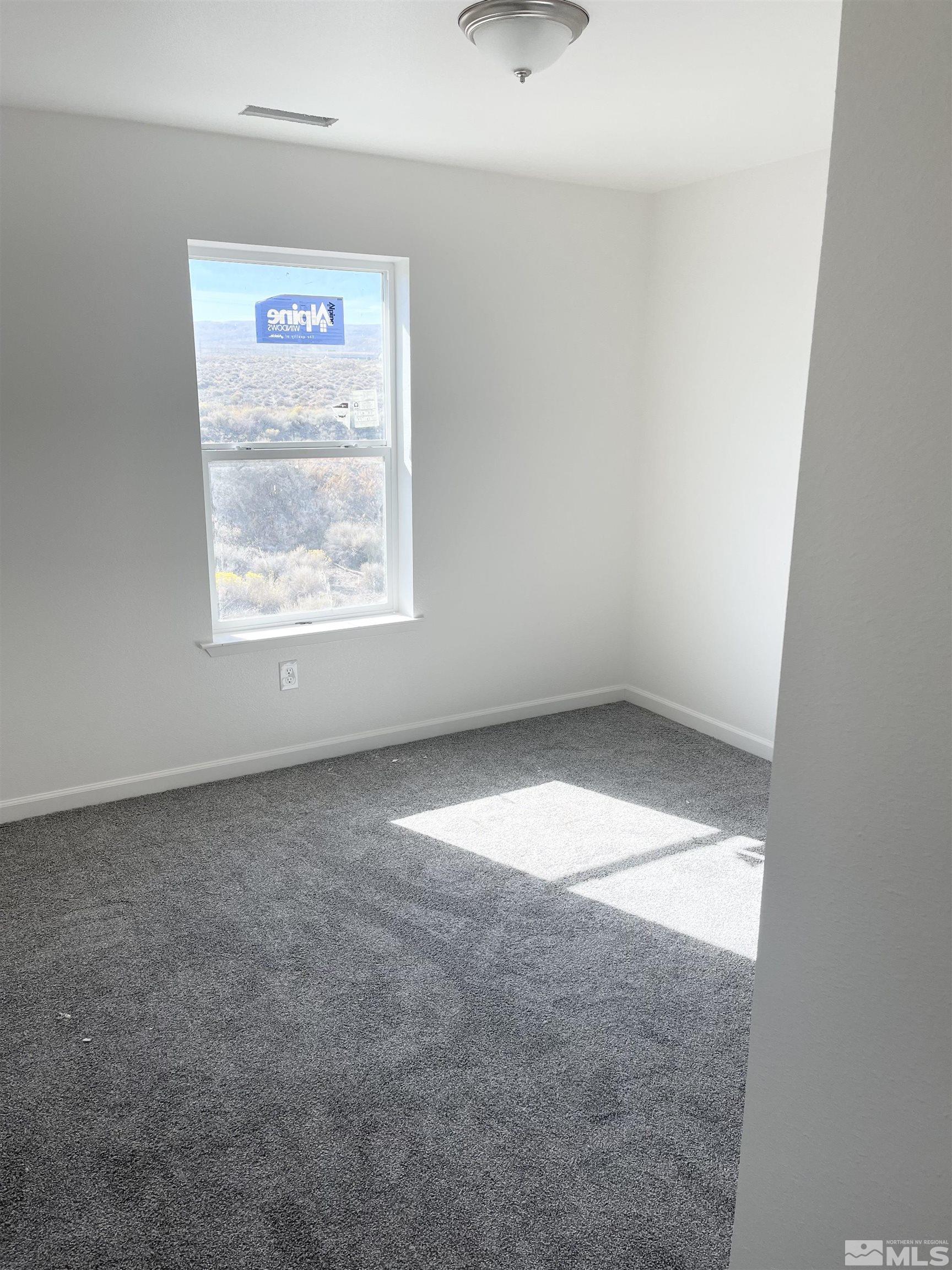 1318 Serenity Circle Fernley, NV 89408 - Photo 5 of 13 an empty room with a window