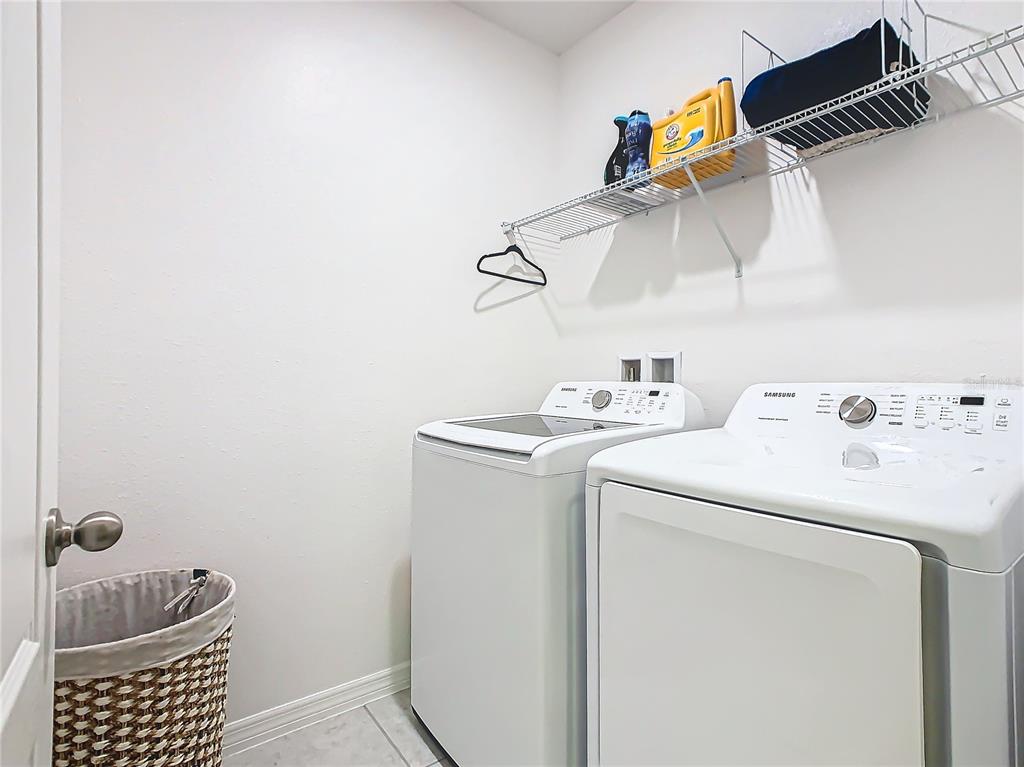 208 Goldenrod Lane Kissimmee, FL 34759 - Photo 35 of 40 a utility room with dryer and washer