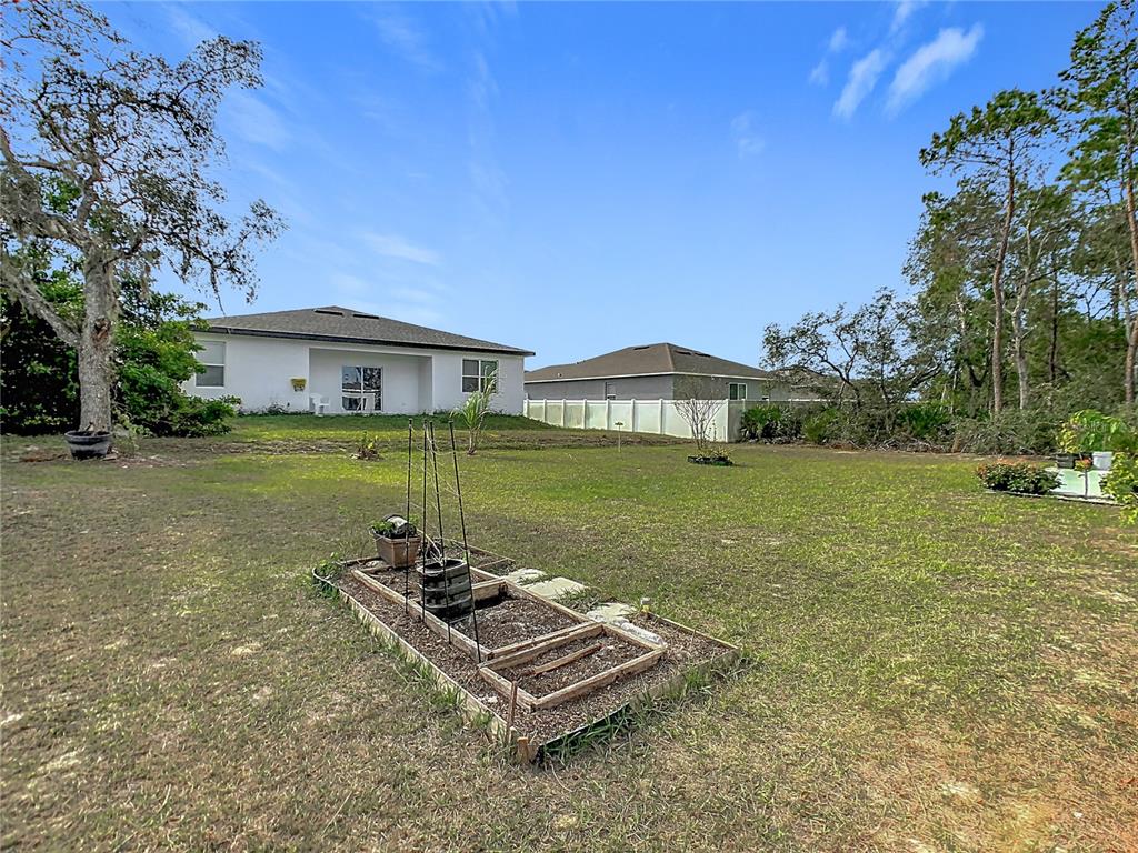 208 Goldenrod Lane Kissimmee, FL 34759 - Photo 39 of 40 a view of a house with a yard
