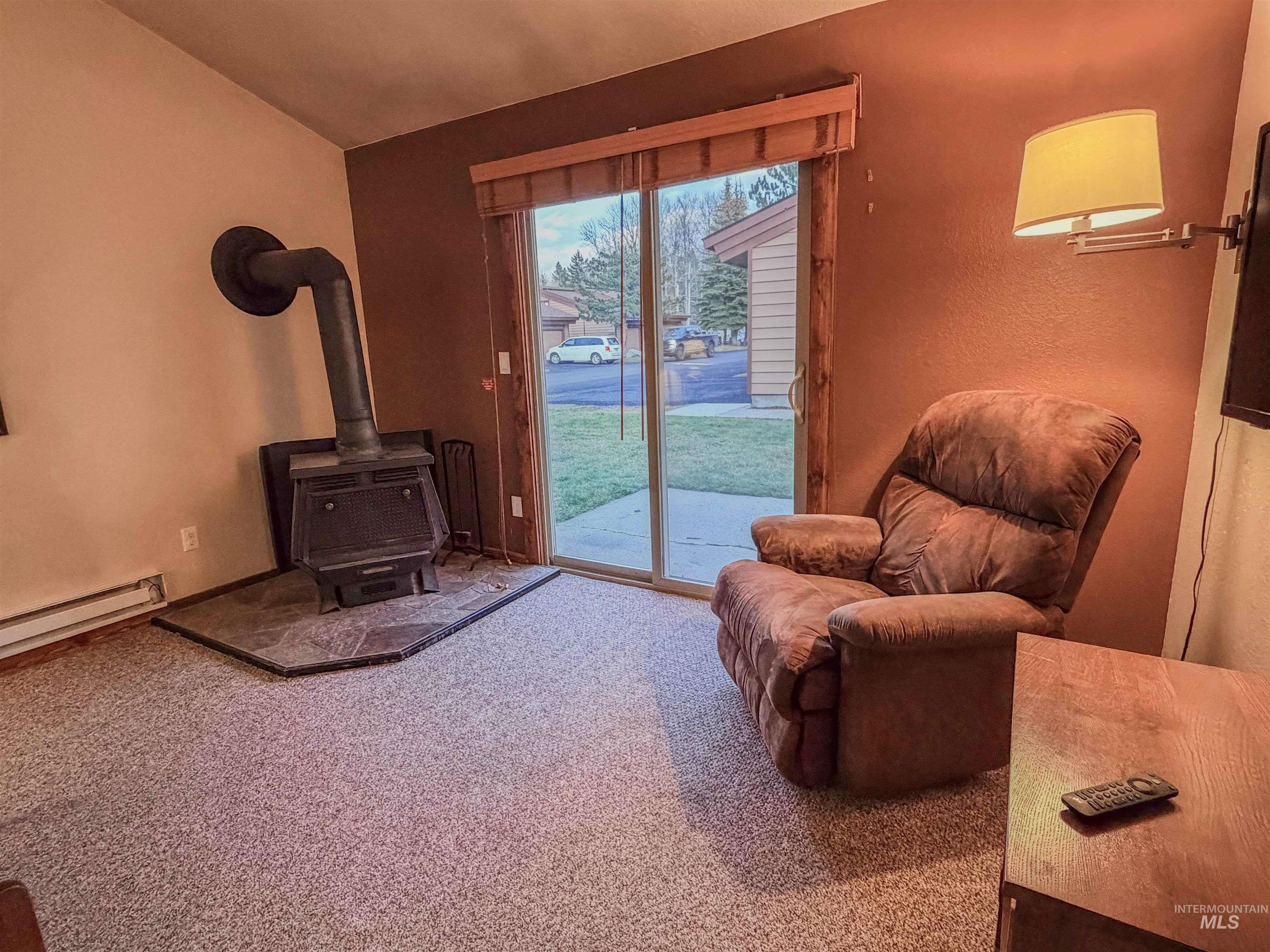 1607 Davis Avenue, Unit C6 McCall, ID 83638 - Photo 4 of 30 Sitting room featuring a wood stove and carpet