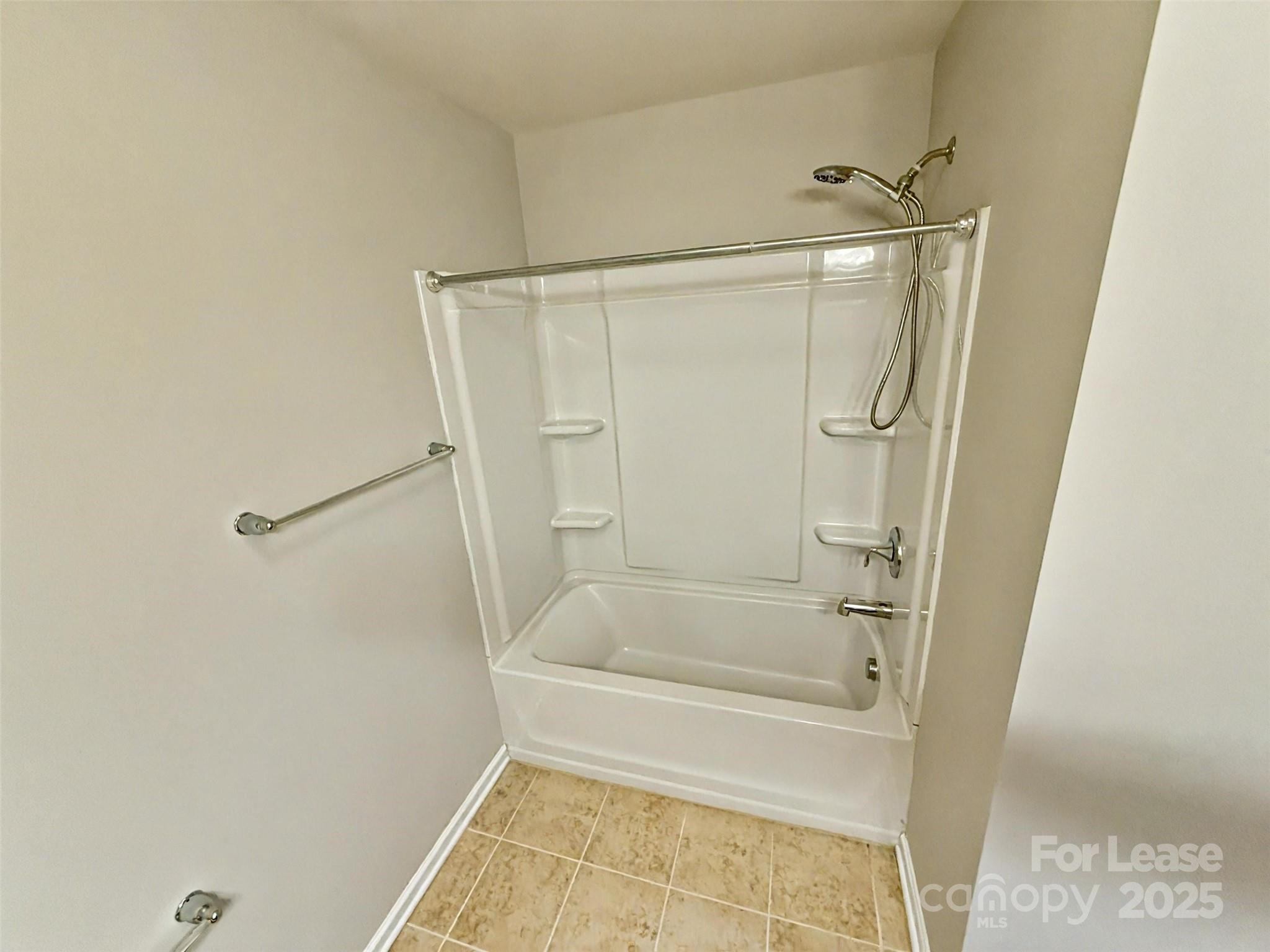 2752 Sawbridge Lane Gastonia, NC 28056 - Photo 20 of 25 a bathroom with a shower and a bath tub